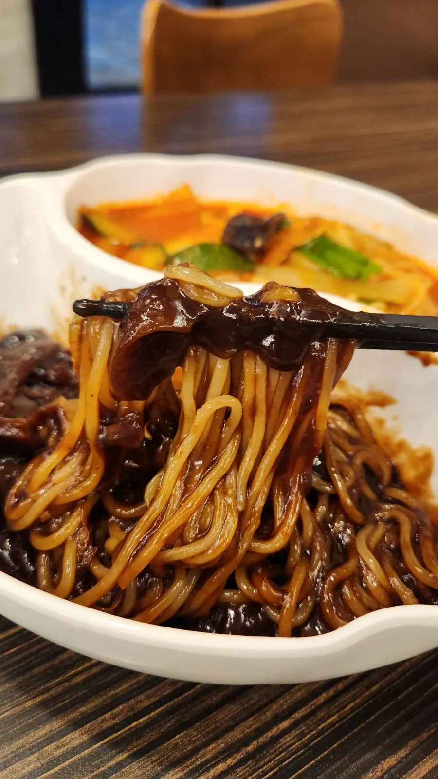 A spoonful of spicy jjamppong broth