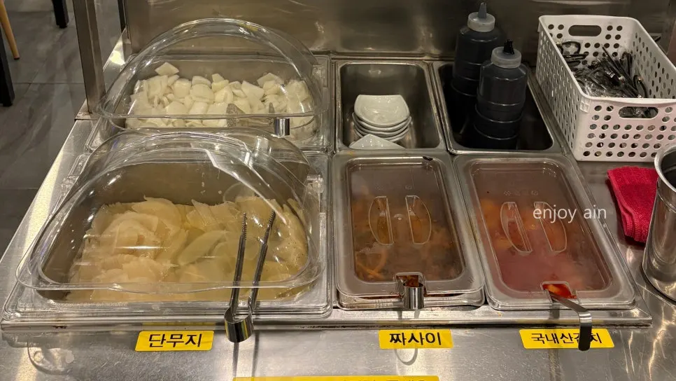Self-serve bar with side dishes and utensils