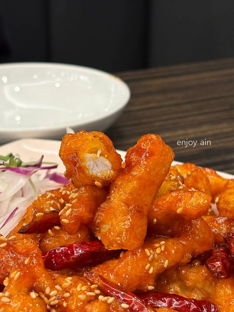 Sweet and sour pork with chewy glutinous rice batter stretching