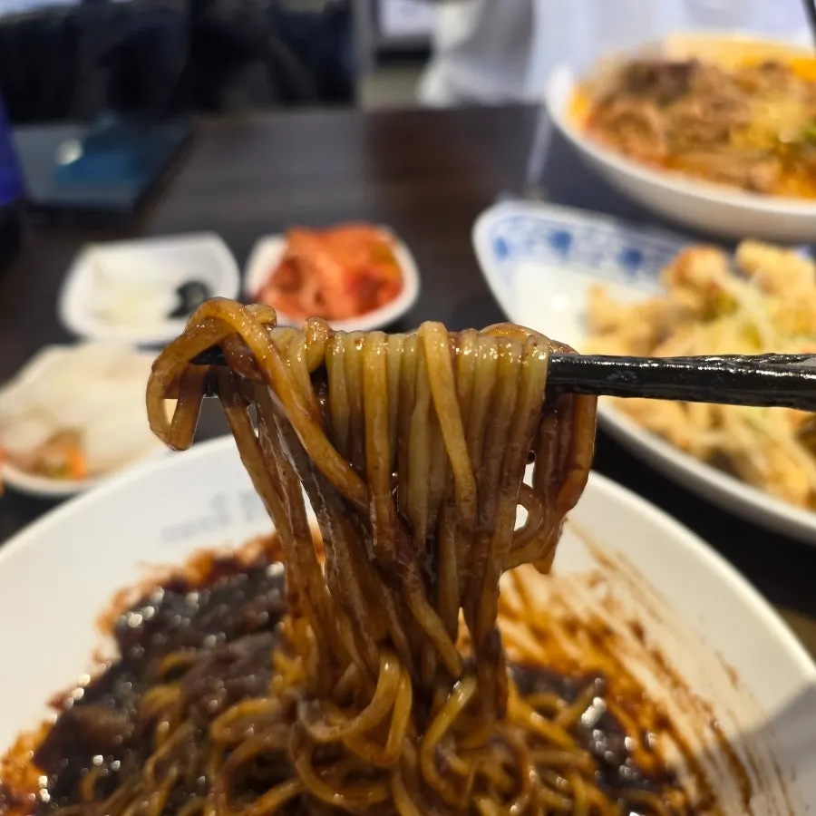 Jjajangmyeon mixed to a glossy finish