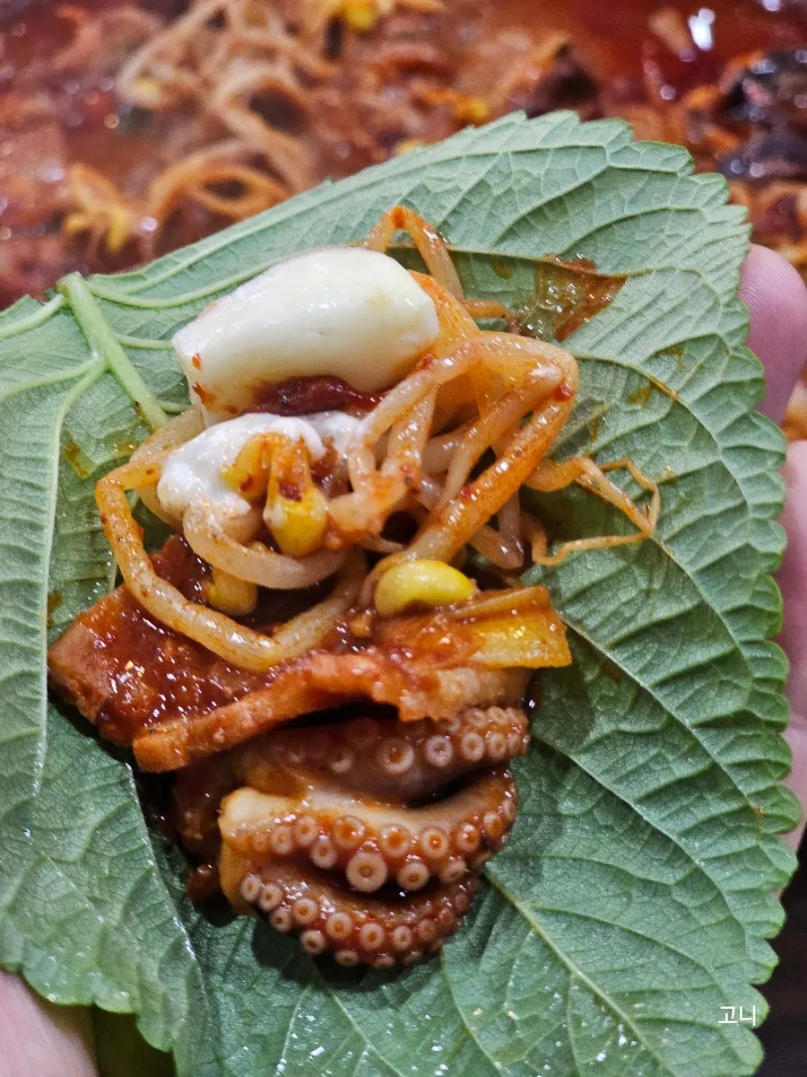 Lettuce wrap with octopus, flying fish roe, and mayo