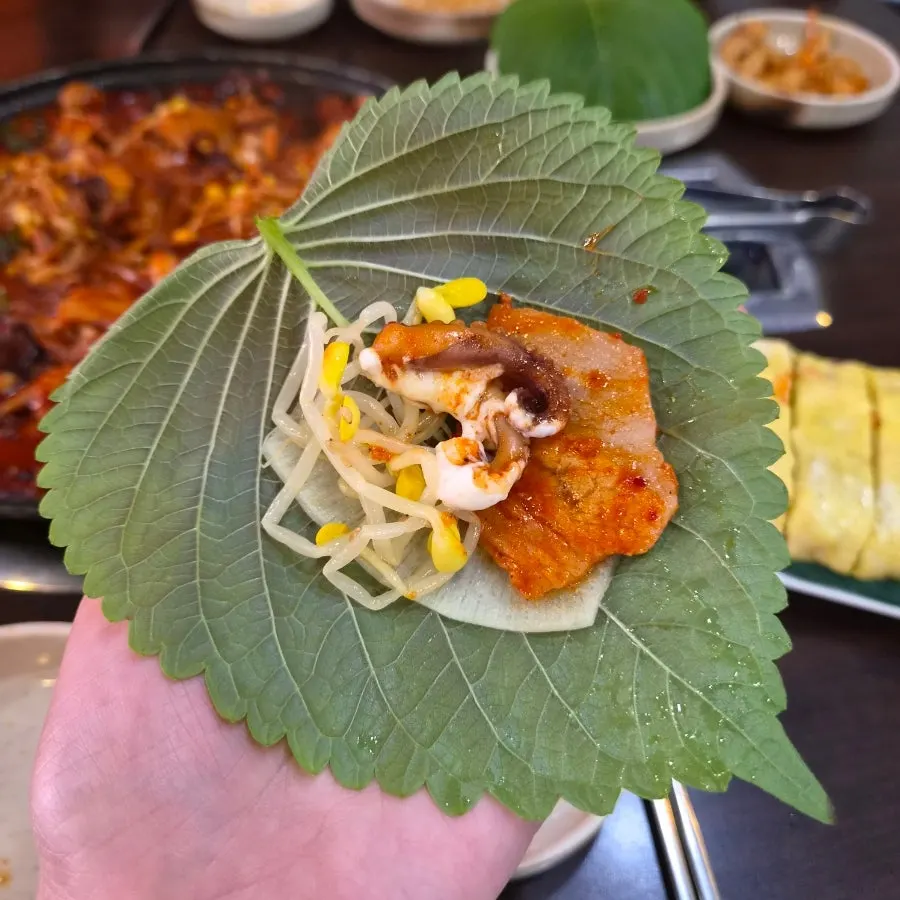 Octopus and pork belly wrapped in a perilla leaf