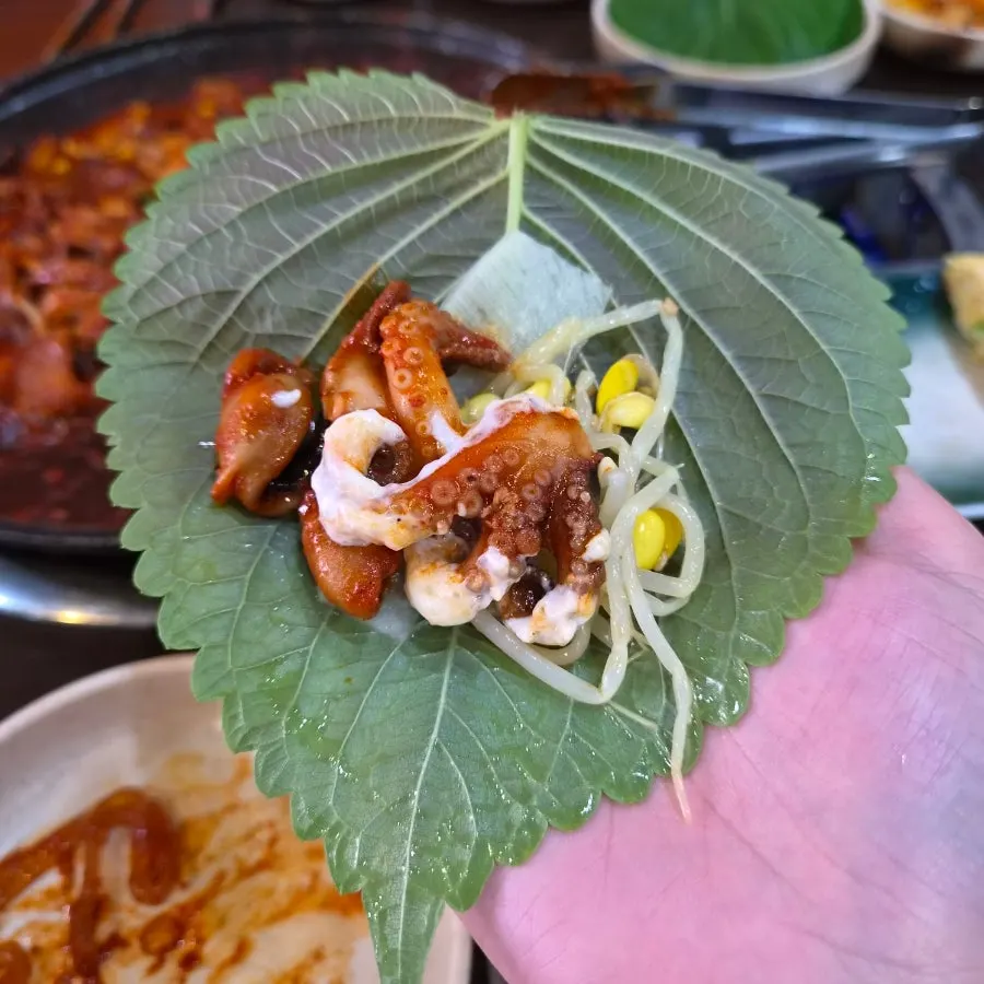 Perilla leaf wrap with flying fish roe mayo sauce and octopus pork belly