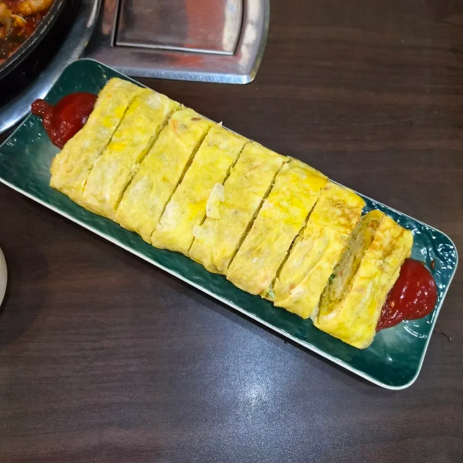 Thick egg roll served at Jjigaen Jjukkumi