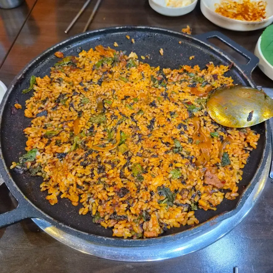 Two servings of fried rice prepared by the owner