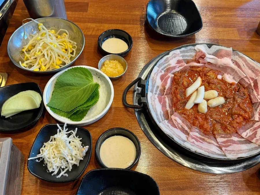 Jjusamgyeop and basic side dishes spread