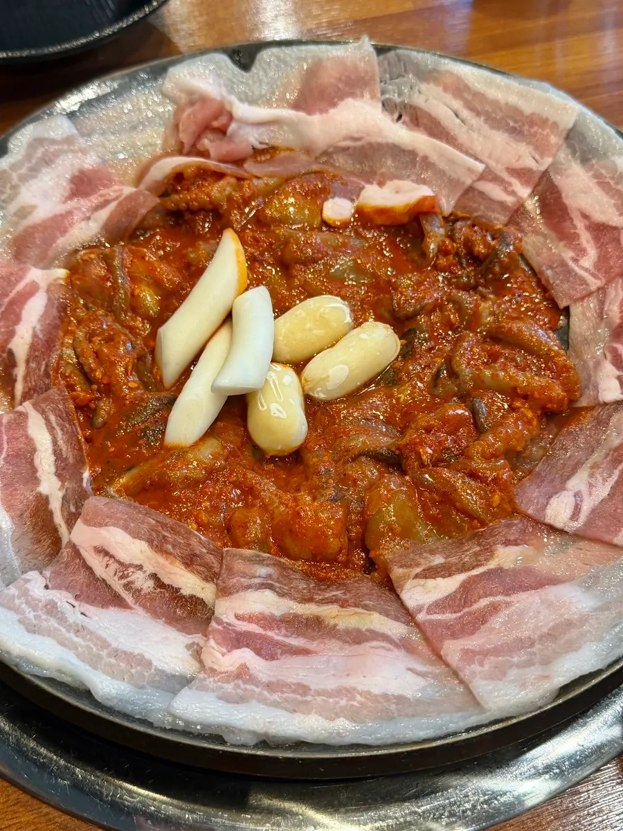 Jjusamgyeop cooking on the griddle