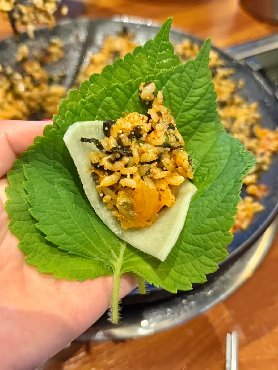 A wrap topped with flying fish roe fried rice