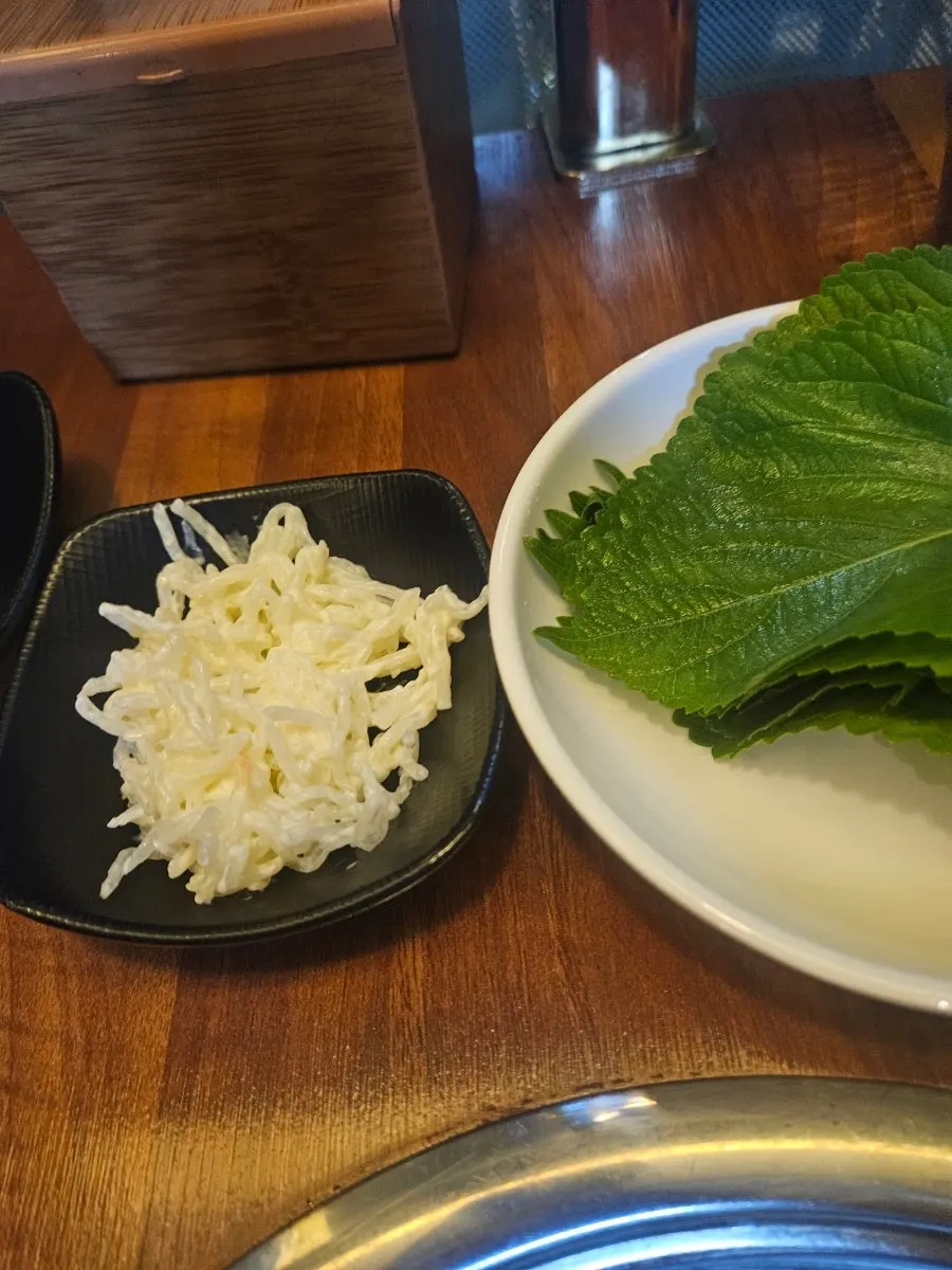 Banchan with radish kimchi and cheonsachae