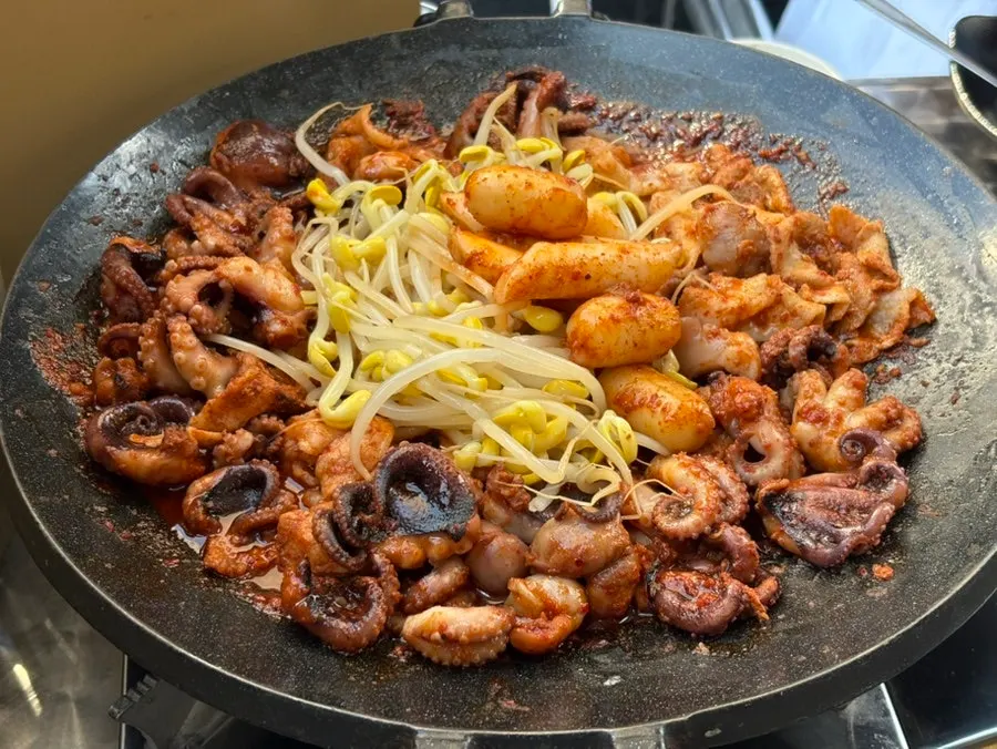 Hot plate piled with a generous 3-serving jjusam portion
