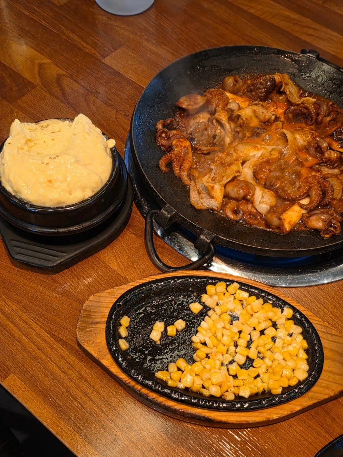 Close-up of cooked jjusamgyeop on the hot plate