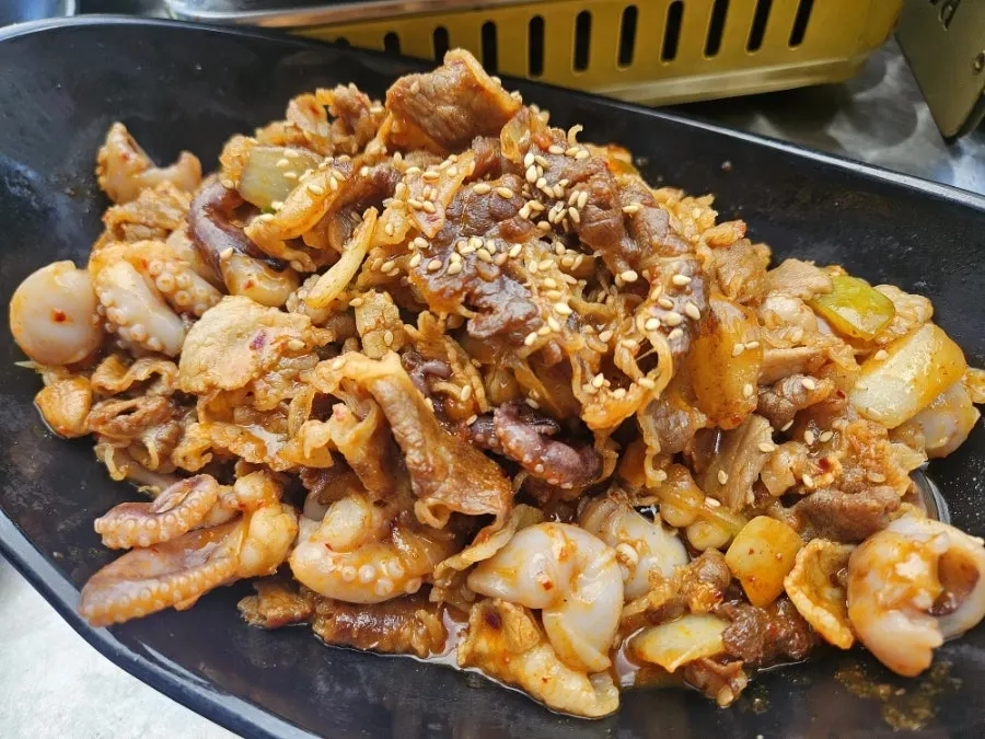 Fire-grilled octopus-pork belly for three on the griddle