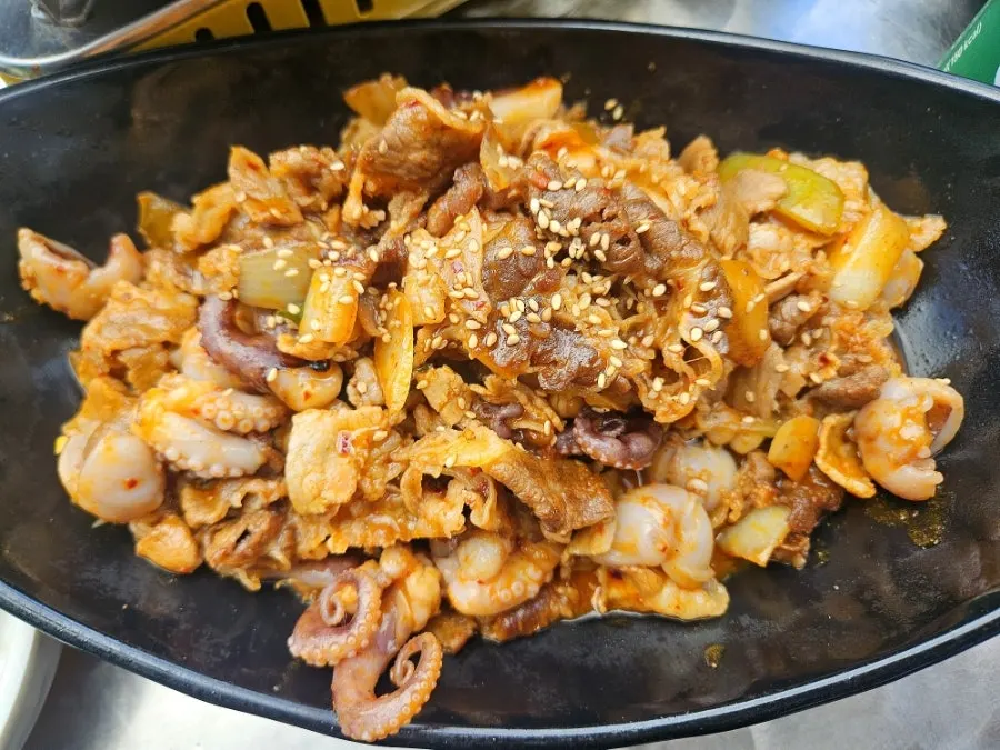 Griddle topped with octopus-pork belly and beef brisket