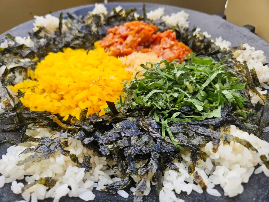Fried rice ingredients with seaweed, perilla leaves, and flying fish roe