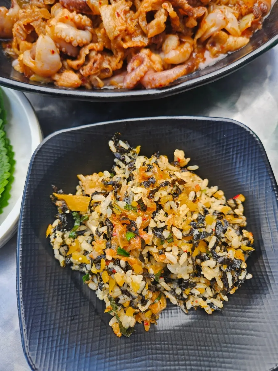Eating octopus-pork belly with fried rice
