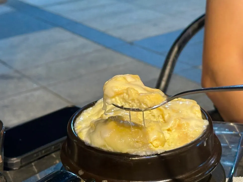 A spoonful of cheese-packed egg custard