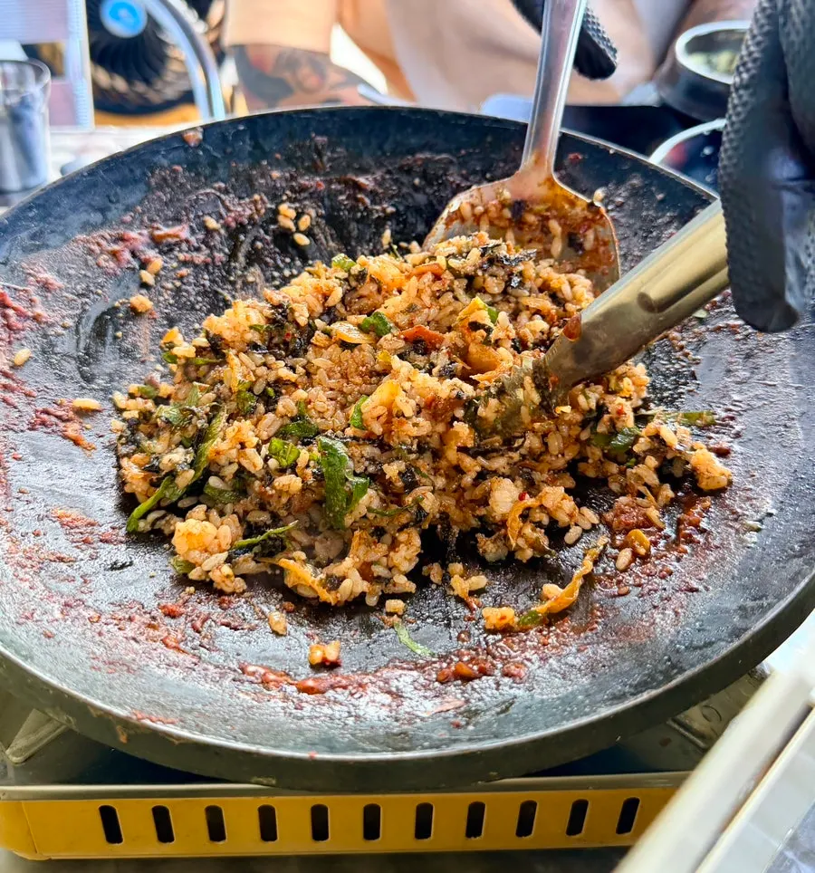 Fried rice ingredients placed on the hot plate