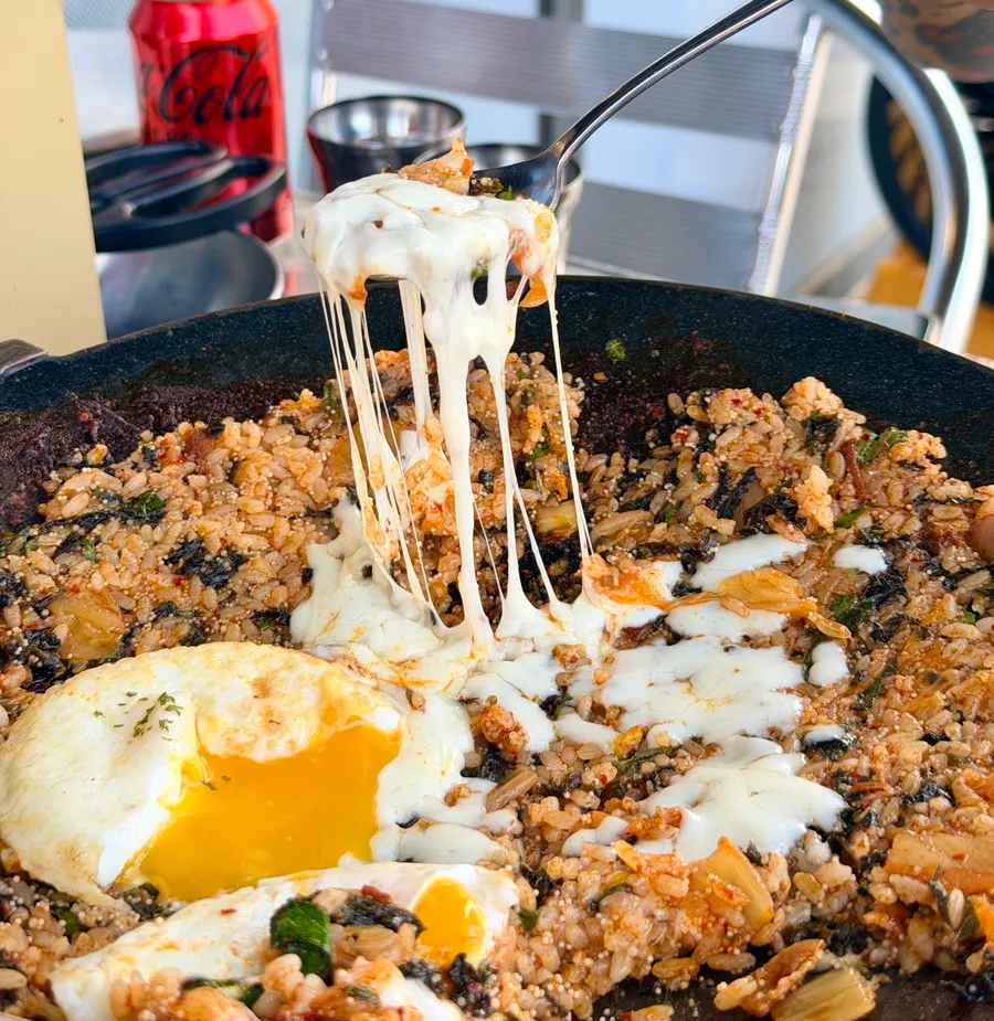Finished fried rice with a soft-fried egg on top