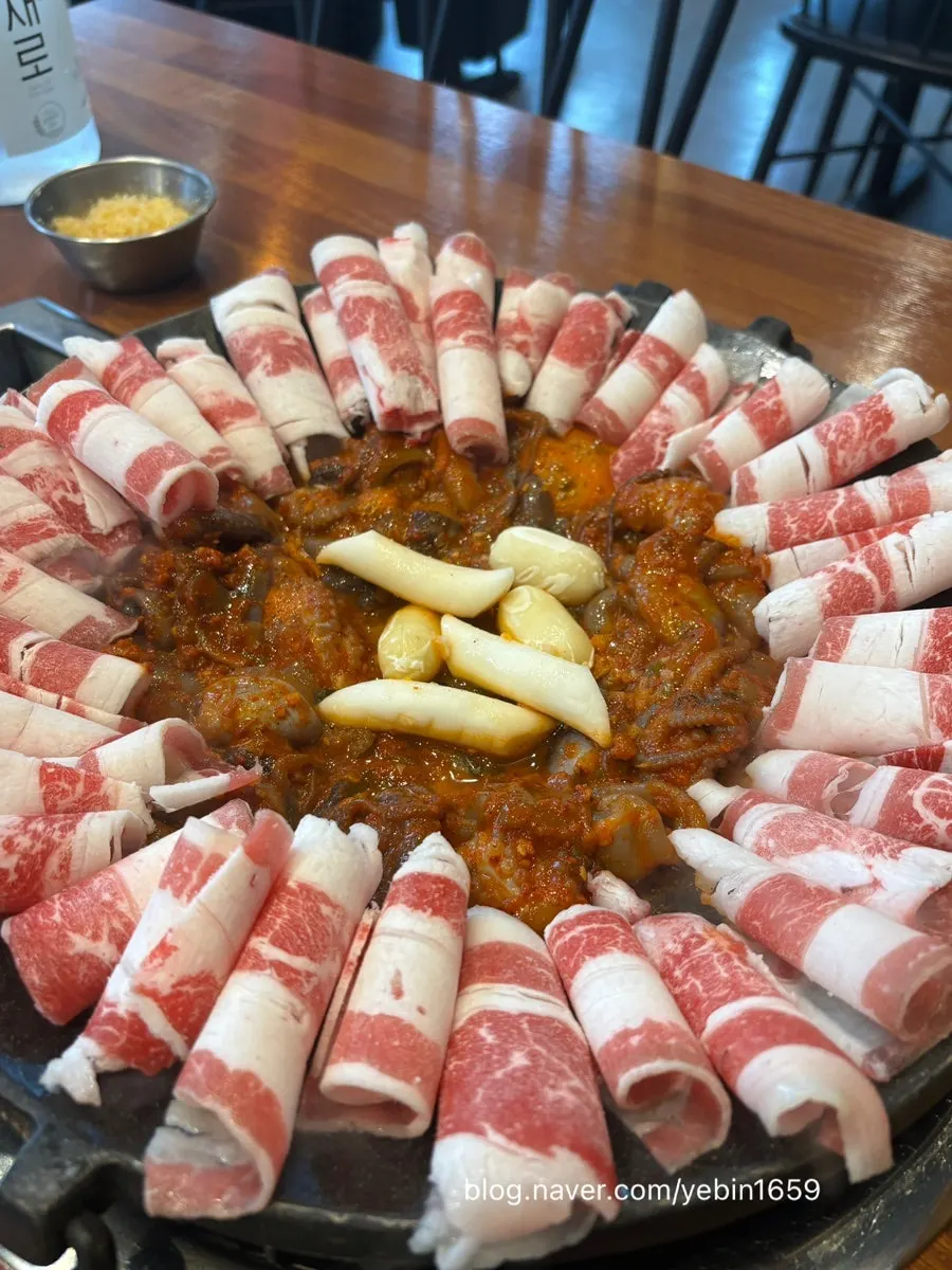 Full octopus hot plate with rice cake on top