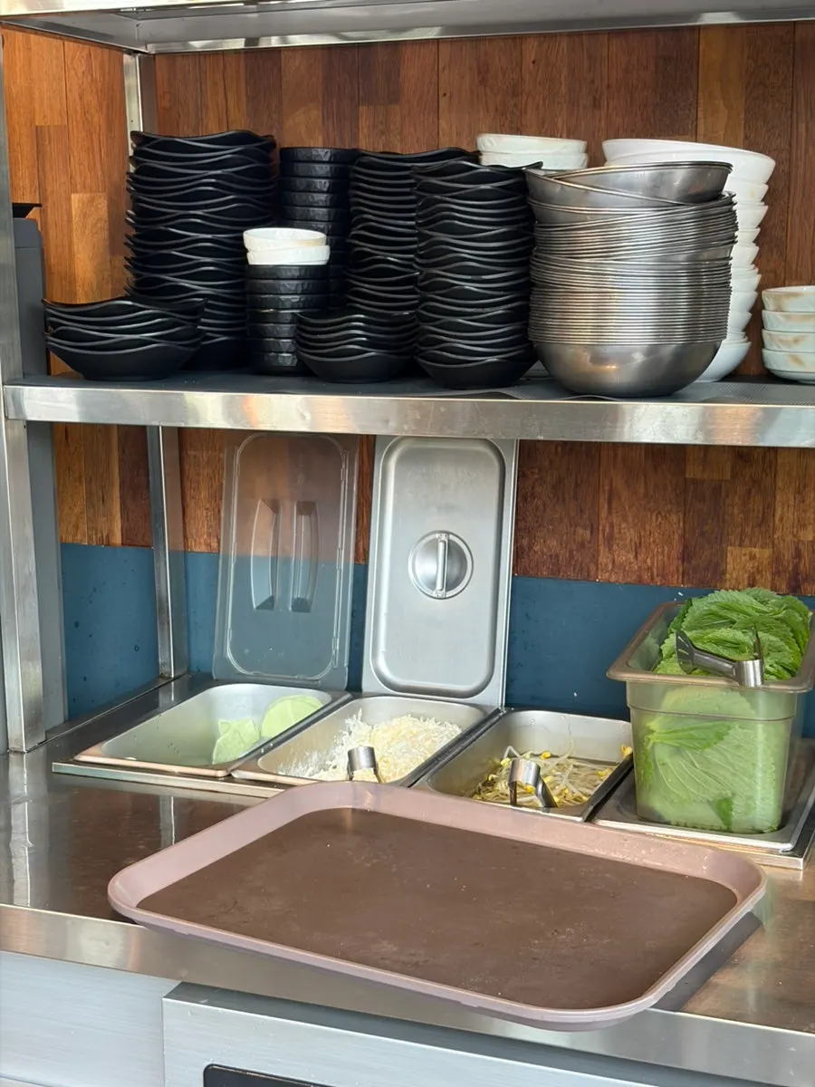 Vegetables and sauces at the self-serve bar