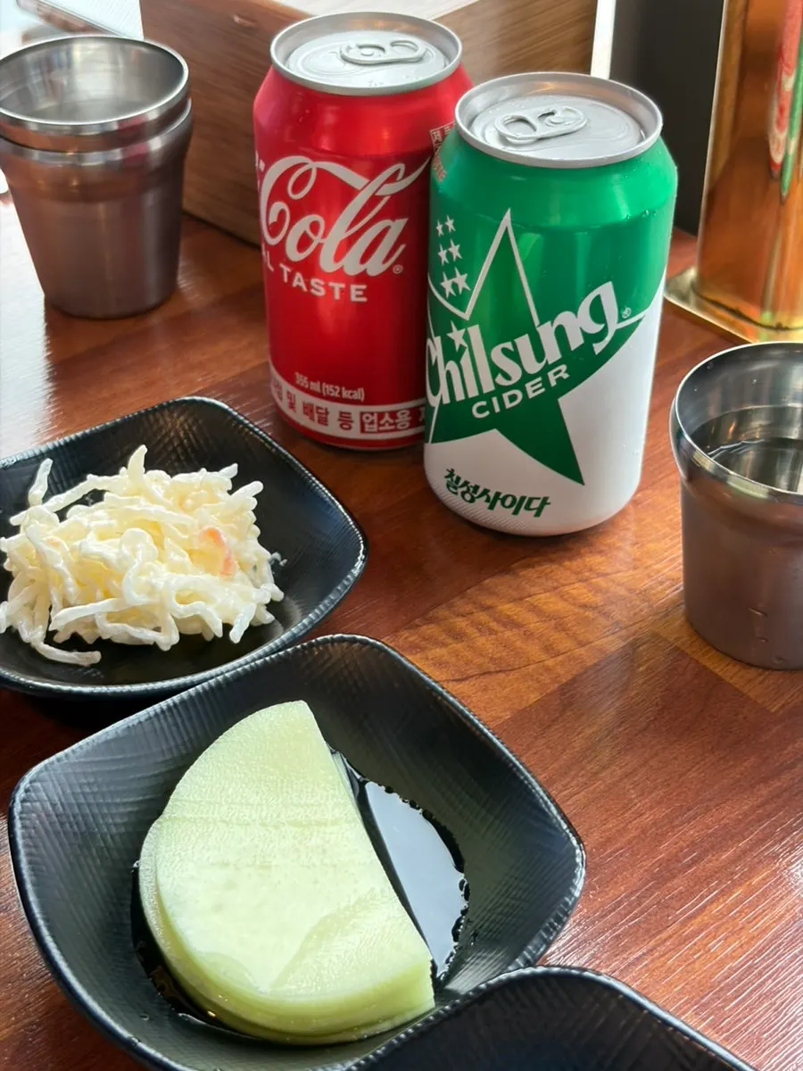 Complimentary bean sprouts, perilla leaves, flying fish roe, and pickled radish