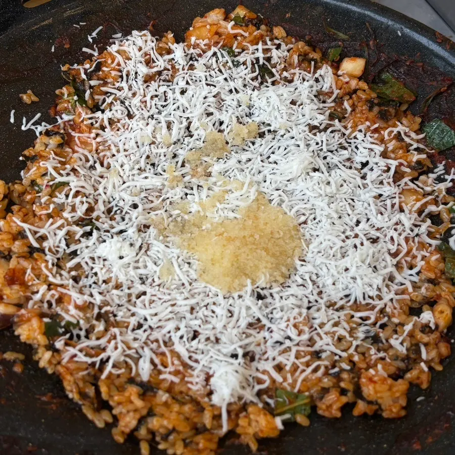 Fried rice topped with cheese and flying fish roe