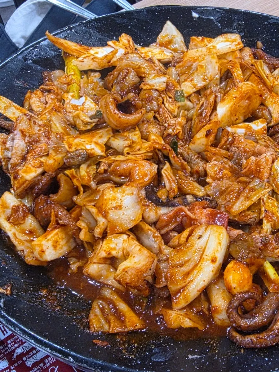 A plate of jjukkumi and pork belly