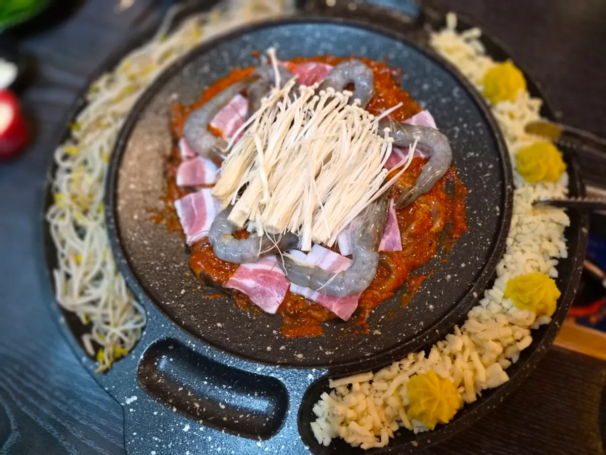 Hot plate of octopus with Rich Gold Cheese Plate and bean sprouts