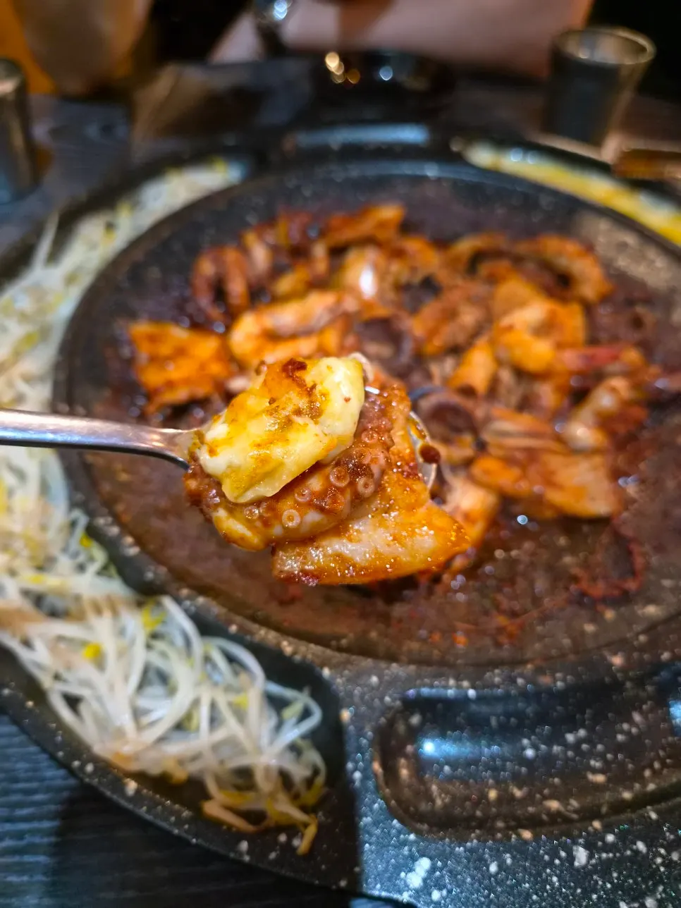 Pork belly, octopus, and cheese piled onto one bite