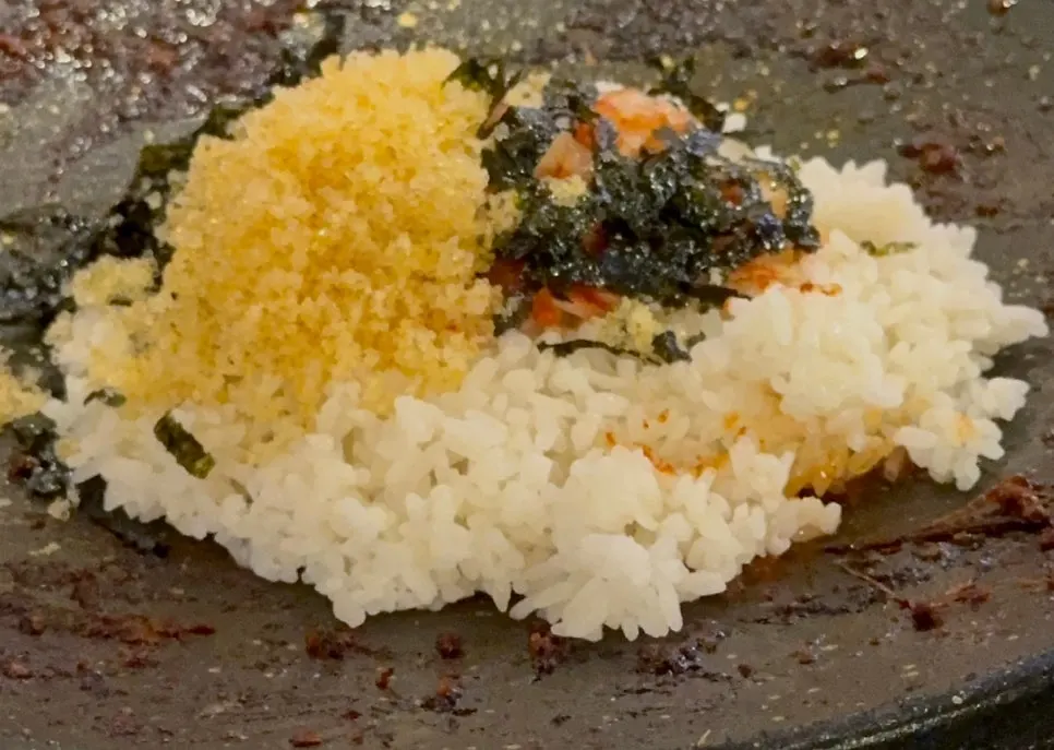 Flying fish roe cheese fried rice cooking on the hot plate