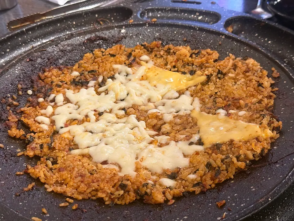 A spoonful of flying fish roe cheese fried rice