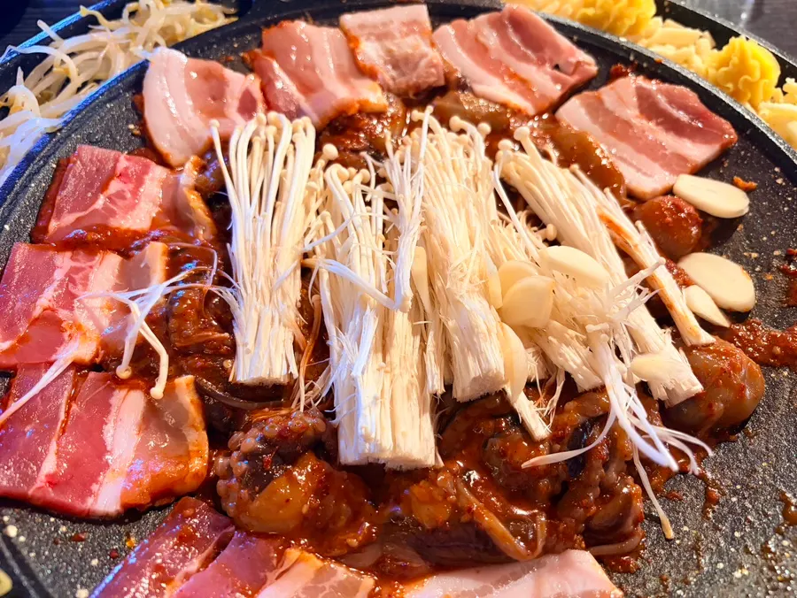 Garlic added to the sizzling octopus pan