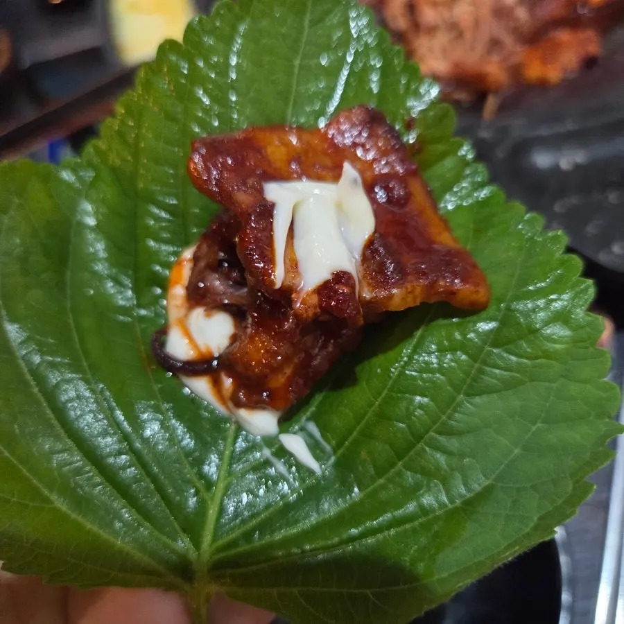 Octopus and pork belly eaten with pickled radish