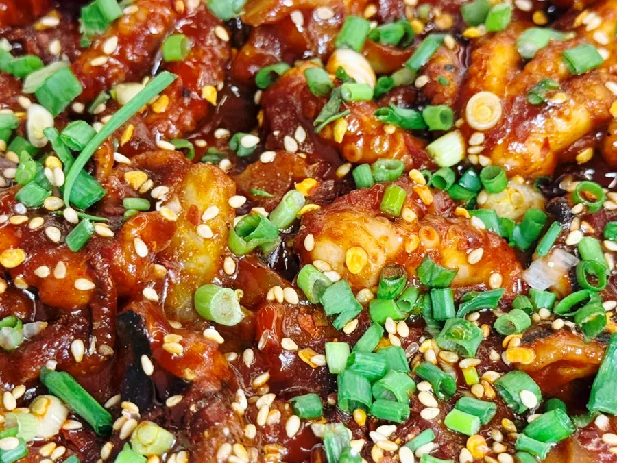 Jjukkumi stir-fry topped generously with scallions and sesame seeds