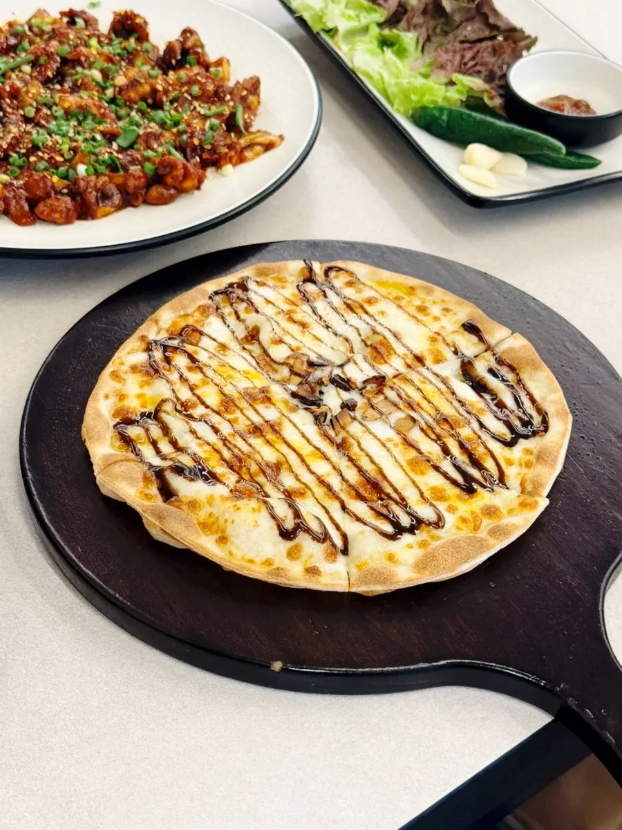 A slice of pizza lifted up