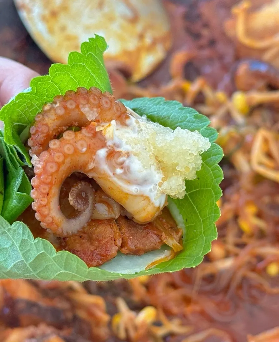 Jjuksam wrapped in perilla leaf with radish pickle