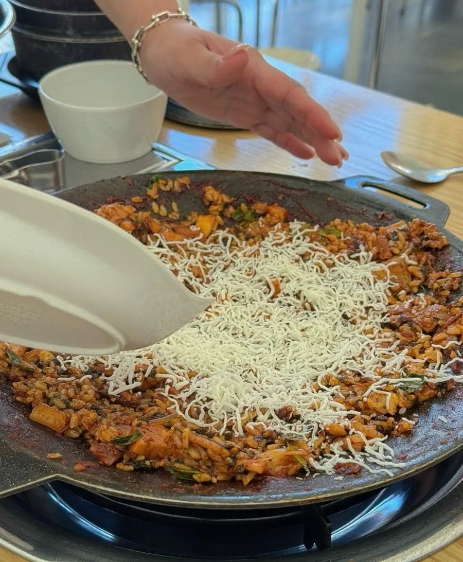 Staff stir-frying the fried rice
