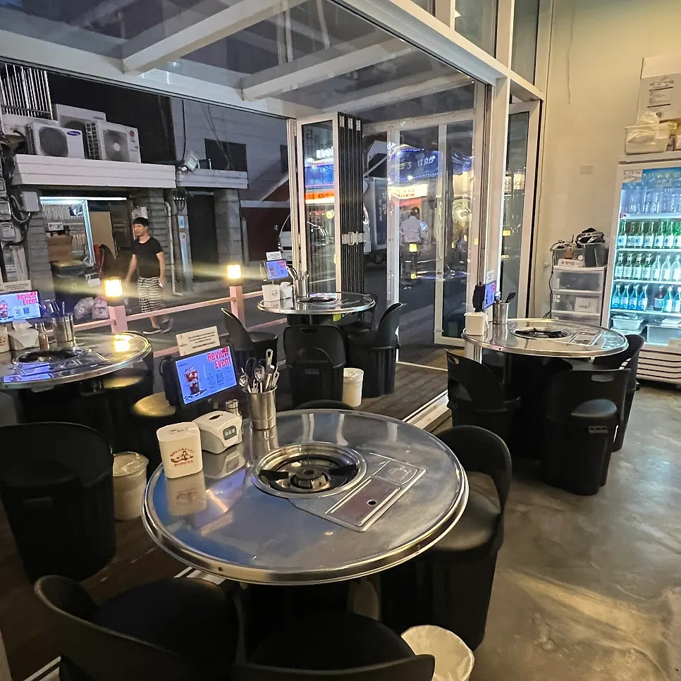 Interior with round, pojangmacha-style tables