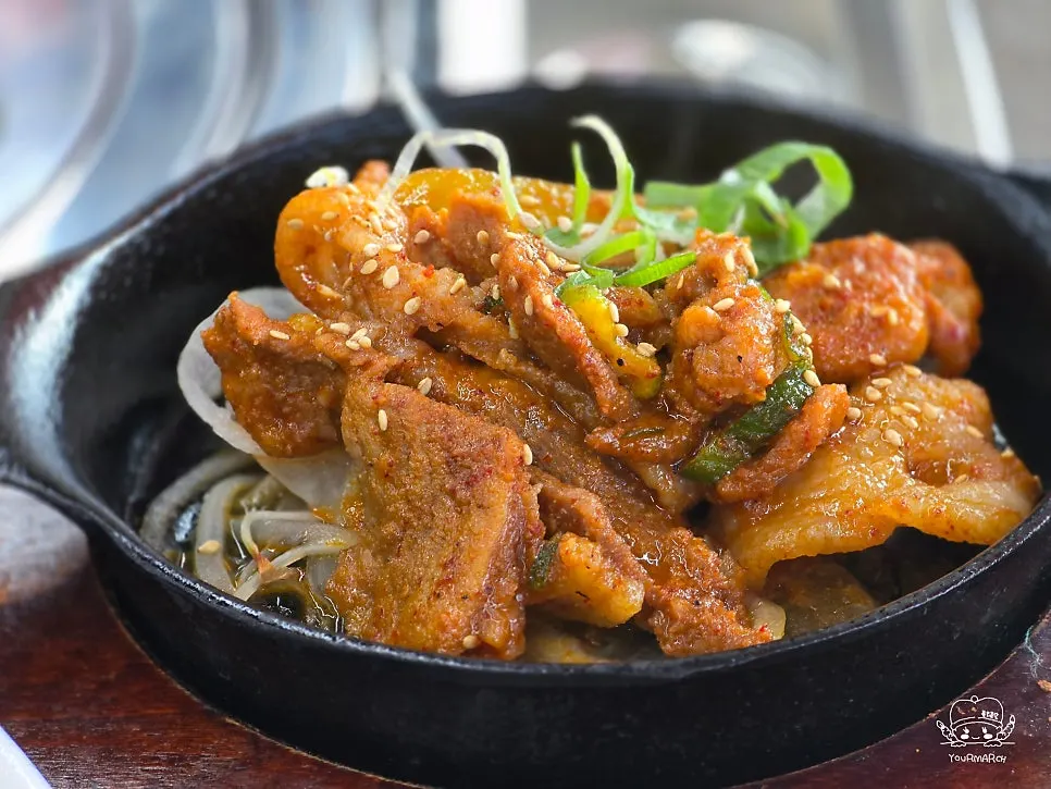 Spicy-sweet jeyuk-bokkeum in a stone bowl