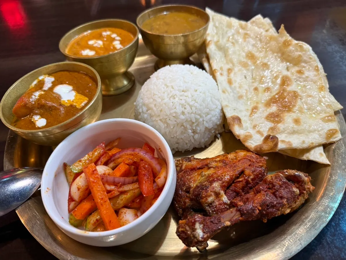 Thali Set Special with tandoori chicken on top