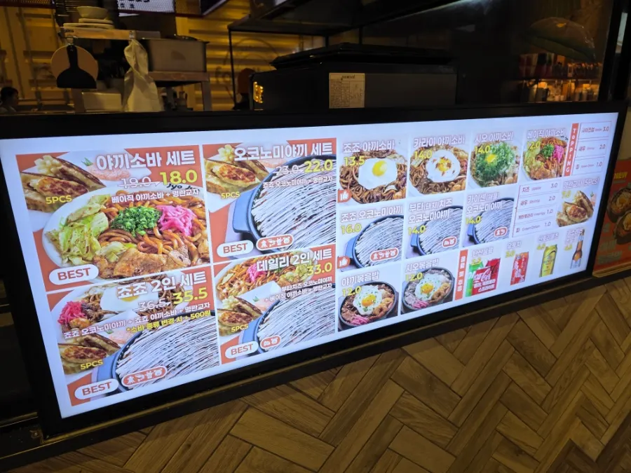 Jojo's menu board listing yakisoba and okonomiyaki