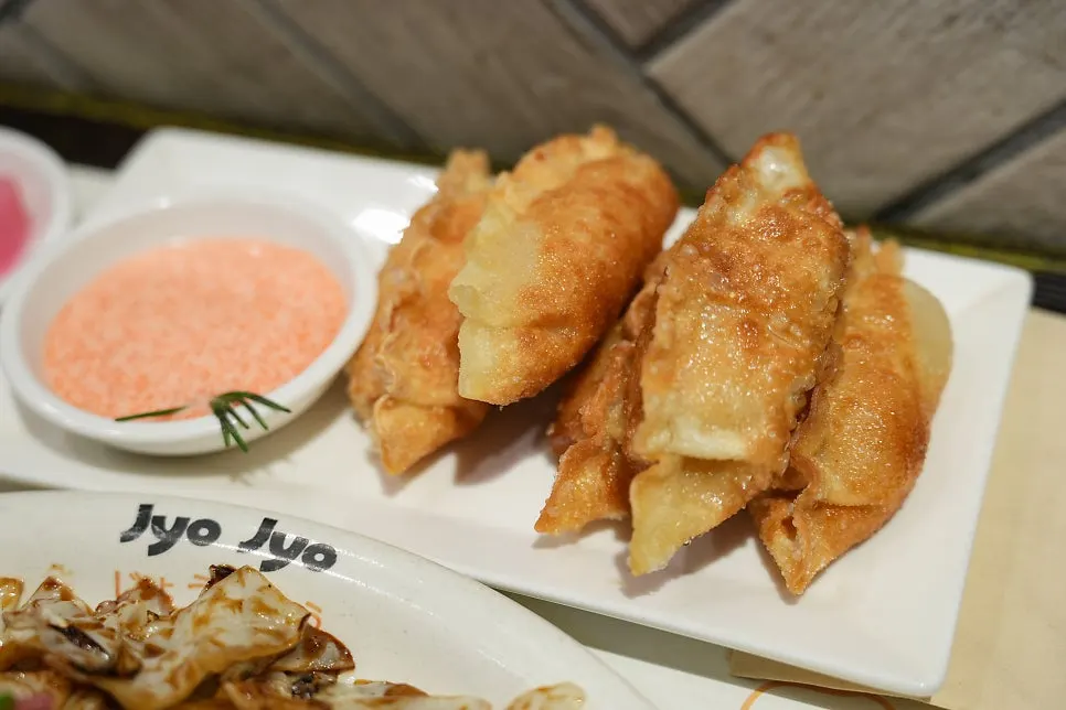 Crispy mentaiko gyoza served with flying fish roe sauce