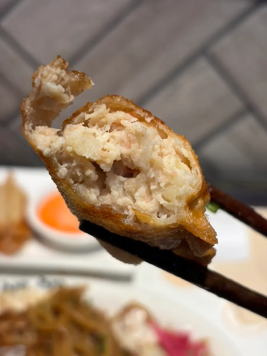 Mentaiko gyoza dipped in mentaiko mayo sauce