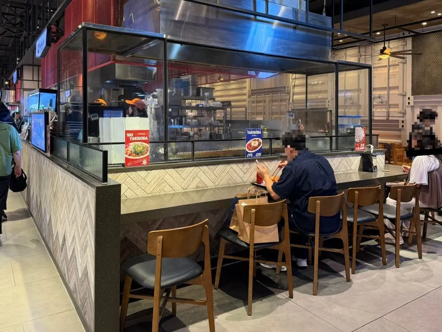 Bar seating wrapped around Jojo's open kitchen