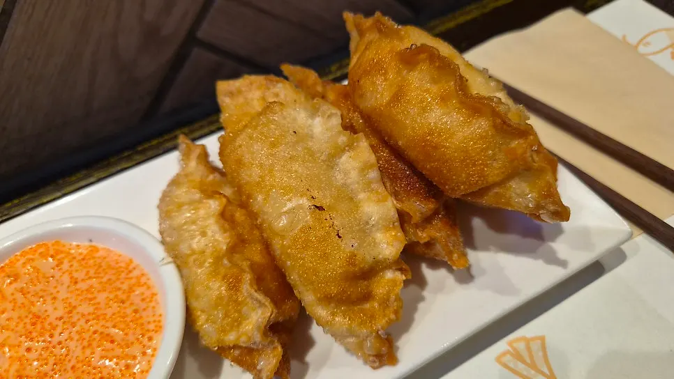 Golden-brown fried surface of the mentaiko gyoza