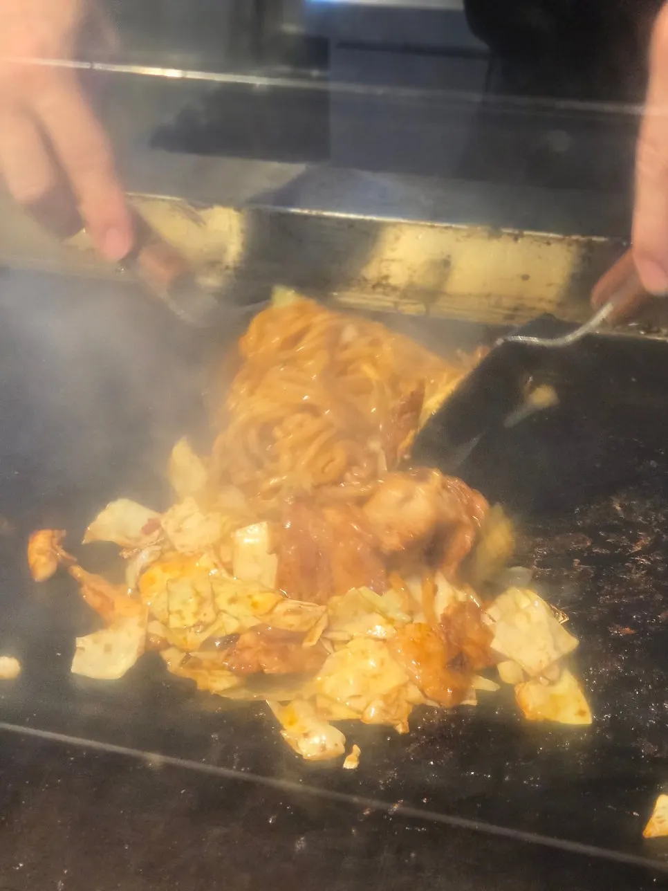 Close-up of yakisoba showing cabbage and squid