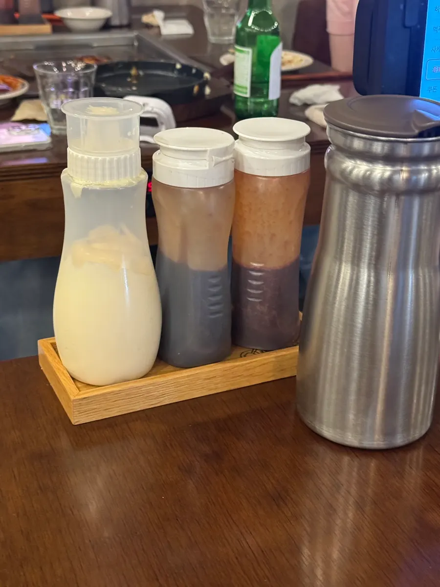 Mayonnaise, teriyaki, and karai sauce on the table