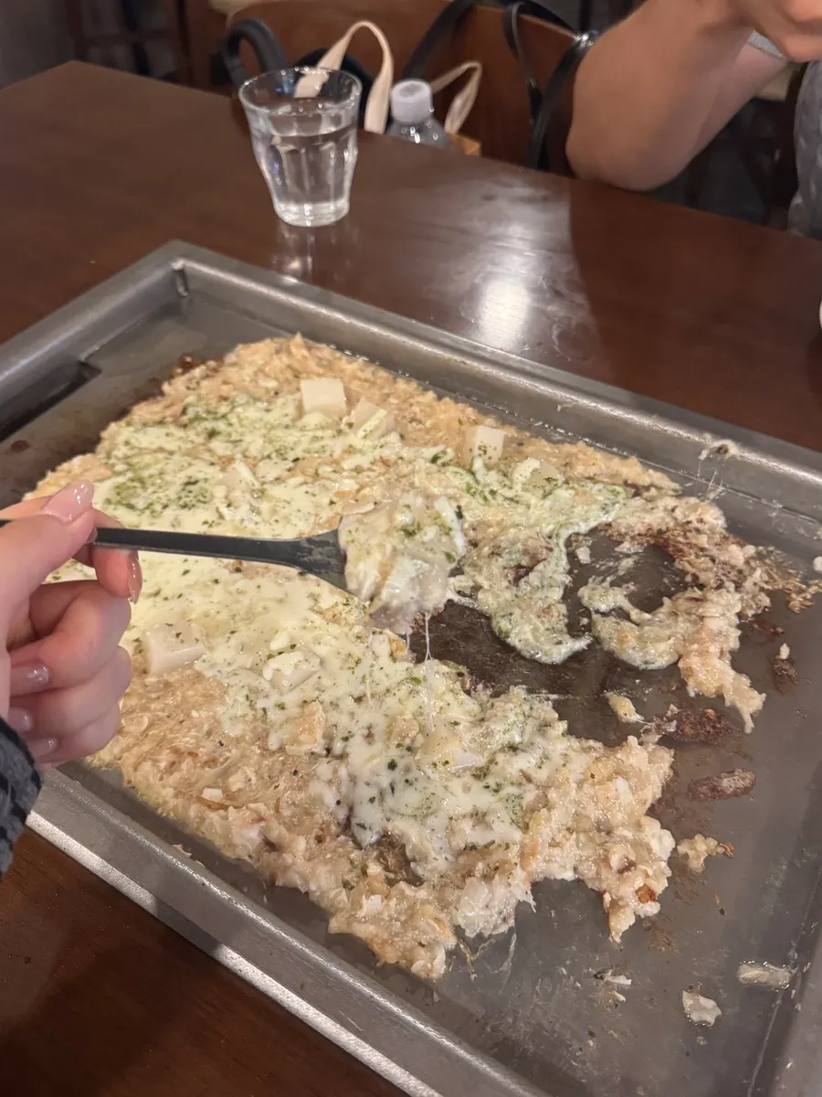Mentaiko monjayaki spread thin on the hot plate