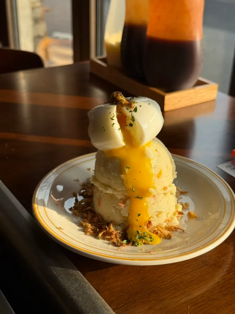 Side dish waterfall potato topped with soft-boiled egg