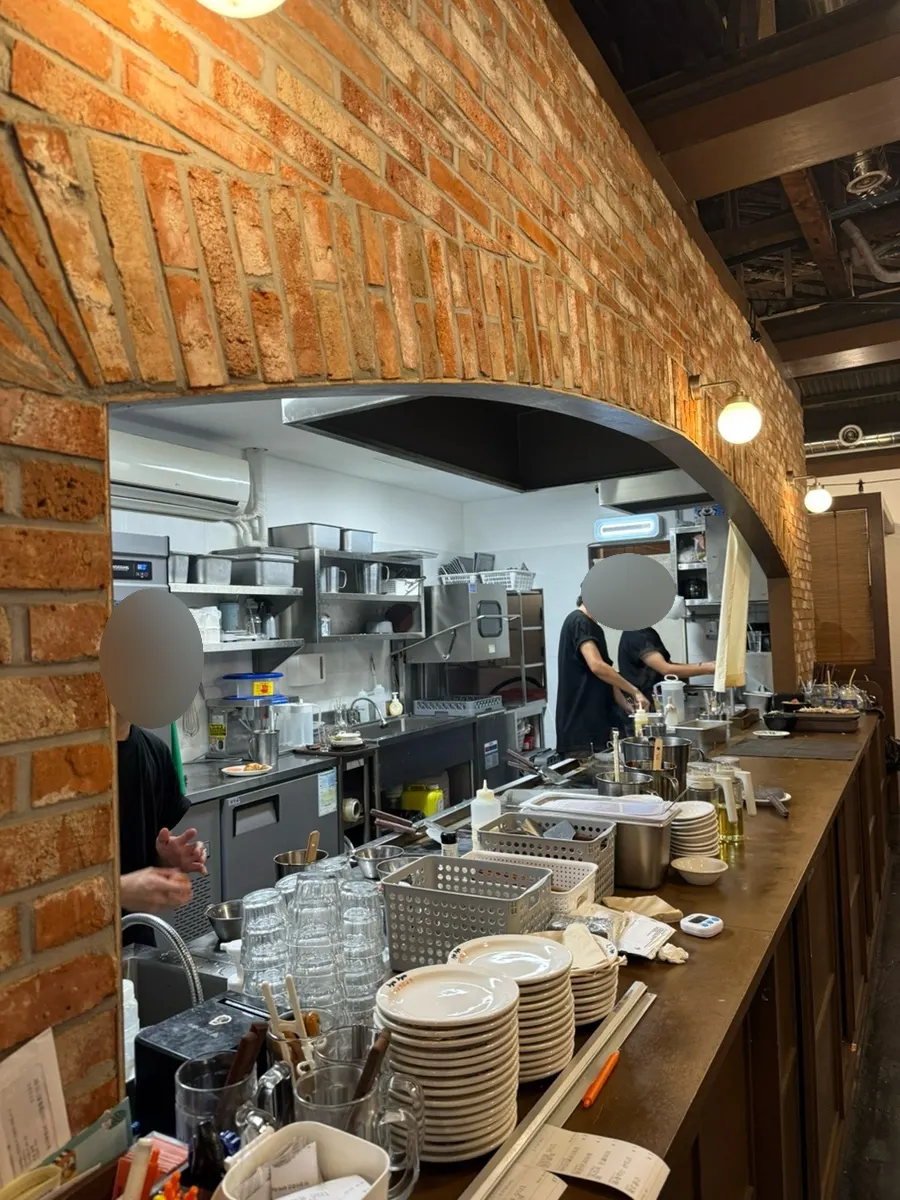 Interior of Jojo Mullae Branch with brick-style decor